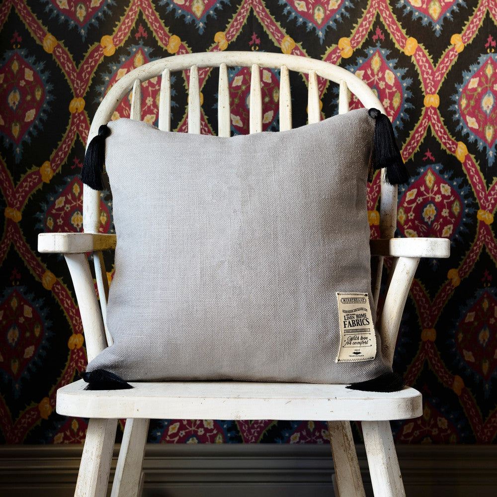 Frost Grey Linen Cushion by Mind the Gap Designer Pillow NOMAD STORY 100% Linen Made in United Kingdom Black tasseled corners 20 x 20 in - Swanky Fabrics -