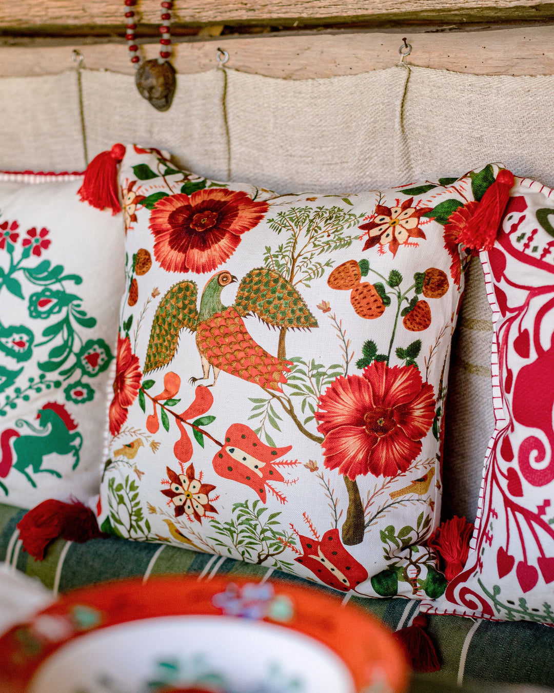 Szekely Folk linen fabric by Mind the Gap (FB00040), cushion room setting