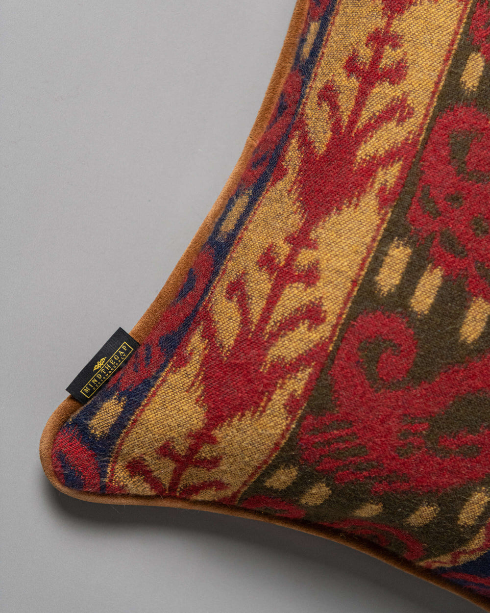 ERZSEBET cushion (LC40274) by Mind The Gap | LC40274 | TRANSYLVANIAN RHAPSODY | 50 x 50 cm / 20 x 20 in | Taupe, Blue, Red, Brown | Tasseled corners | Duck feather | 27% Acrylic, 32% Cotton, Other Fibers | Fabric Carolina | https://www.fabriccarolina.com/