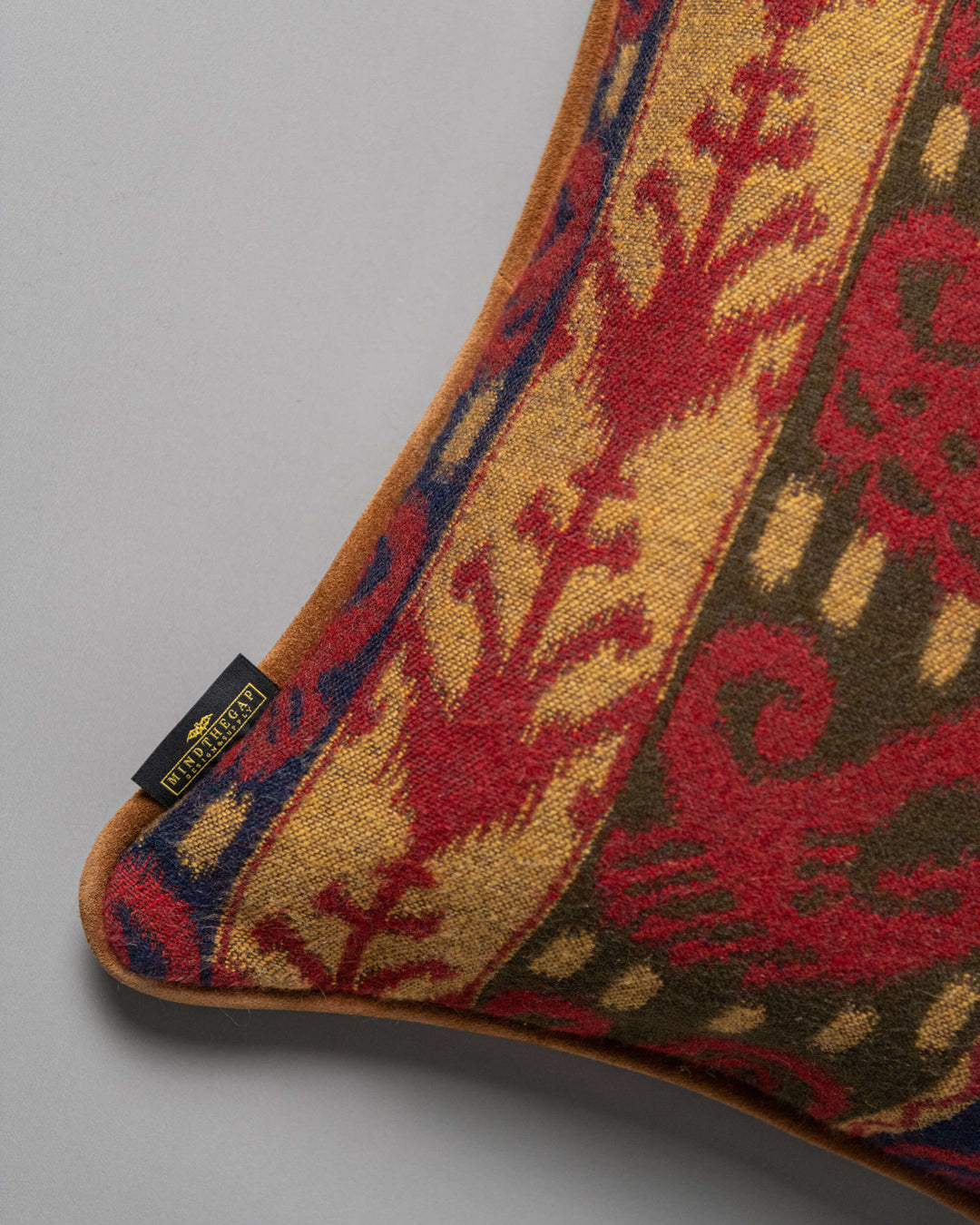 ERZSEBET cushion (LC40274) by Mind The Gap | LC40274 | TRANSYLVANIAN RHAPSODY | 50 x 50 cm / 20 x 20 in | Taupe, Blue, Red, Brown | Tasseled corners | Duck feather | 27% Acrylic, 32% Cotton, Other Fibers | Fabric Carolina | https://www.fabriccarolina.com/