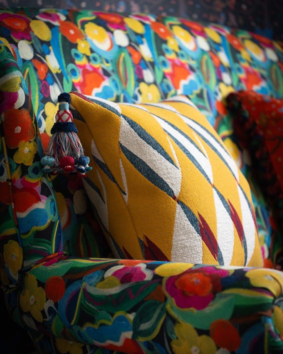 GLORIA cushion (LC40281) by Mind The Gap | LC40281 | TRANSYLVANIAN RHAPSODY | 50 x 50 cm / 20 x 20 in | Blue, White, Yellow, Red | Tasseled corners | Duck feather | 82% Cotton, 10% Polyamide, Other Fibers | Fabric Carolina | https://www.fabriccarolina.com/