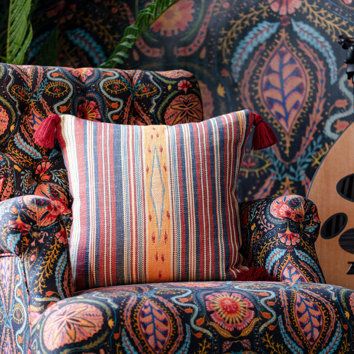 Neyshabour Cushion by Mind the Gap Designer Pillow WOODSTOCK '69 LIFESTYLE COLLECTION 64% Cotton, 27% Viscose, 9% Linen Made in Romania Red tassels 20 x 20 in - Swanky Fabrics -