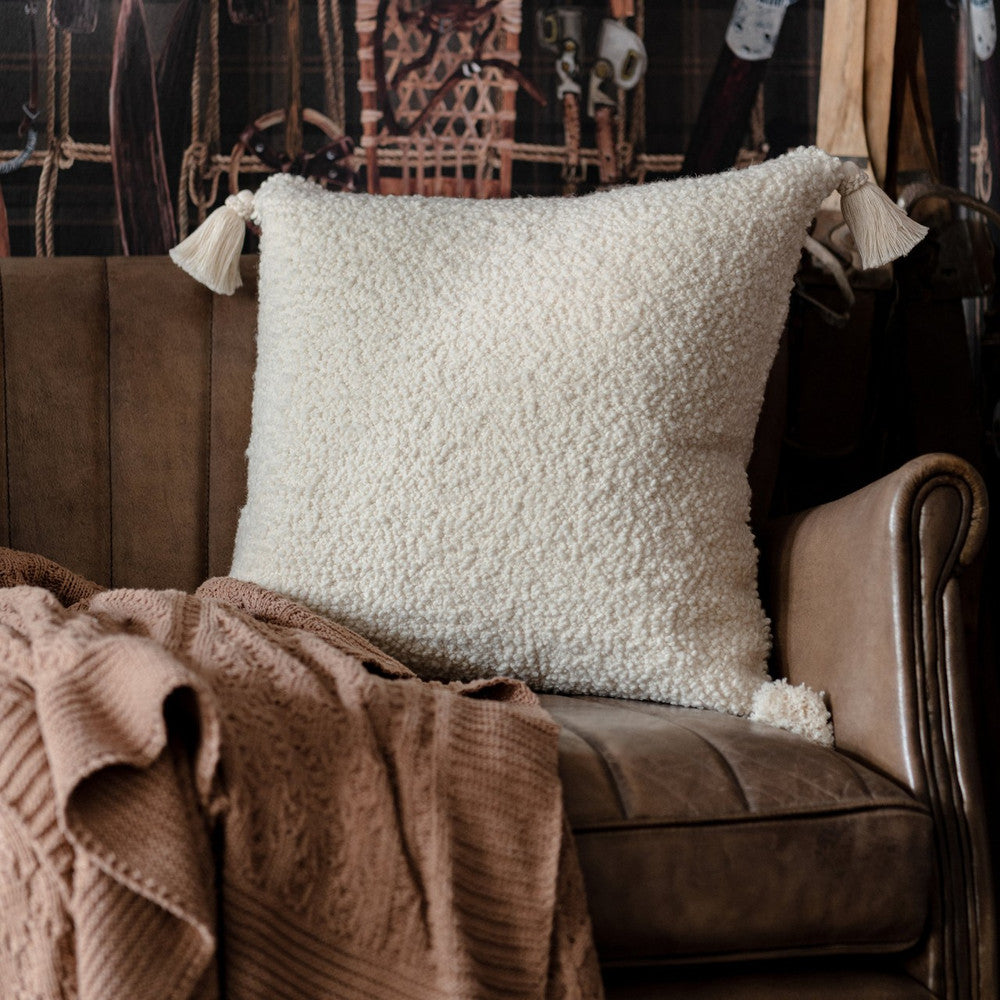 Schaffell Cushion by Mind the Gap Designer Pillow TYROL APRES-SKI HOME COLLECTION 72% Wool, 21% Cotton, 7% other fibres Made in Romania Tasseled corners 20 x 20 in - Swanky Fabrics -