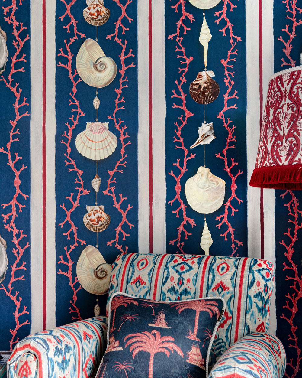 COQUILLAGE Samba Red Wallpaper (WP20573) by Mind The Gap | WP20573 | SUNDANCE VILLA | 3 rolls x 52x300 cm / 20.5x118.1 in | 0.52m / 20.5in | 3m / 118in | 4.65sqm / 50sq ft | 100cm / 39.3in | Blue, White, Red | Non-woven Textured | Paste the wall | 3-rolls in a box | Fabric Carolina | https://www.fabriccarolina.com/