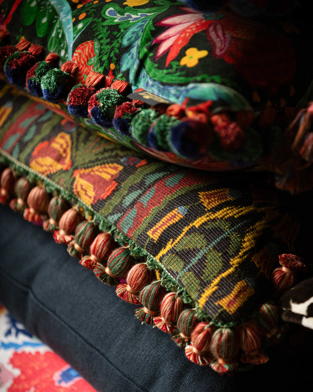 SERENADE cushion (LC40277) by Mind The Gap | LC40277 | TRANSYLVANIAN RHAPSODY | 50 x 50 cm / 20 x 20 in | Black, Green, Yellow, Red | Fringes all around | Duck feather | 27% Acrylic, 37% Cotton, Other Fibers | Fabric Carolina | https://www.fabriccarolina.com/